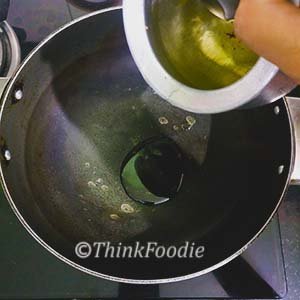 Heat oil in pot. 
